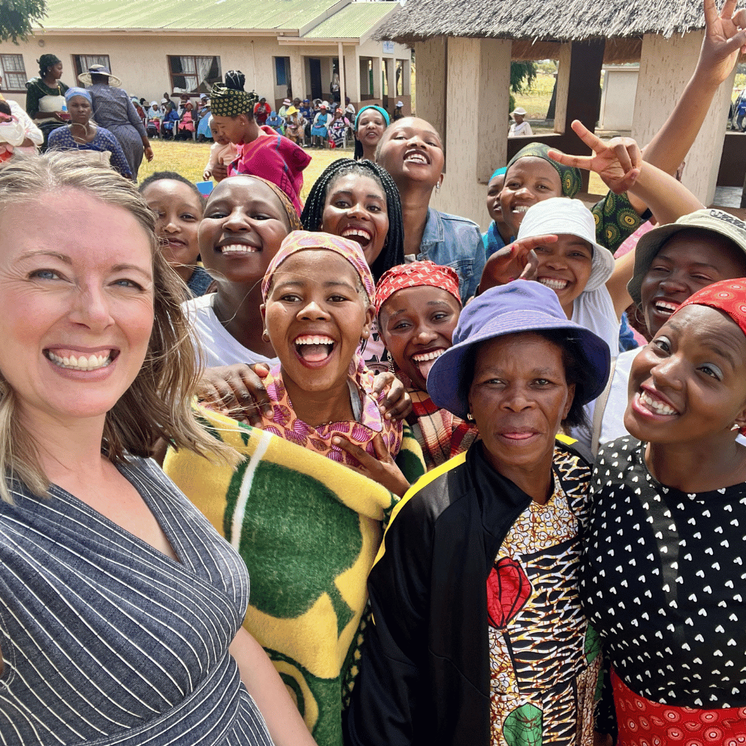 Executive Director Kate poses with a group of young mothers