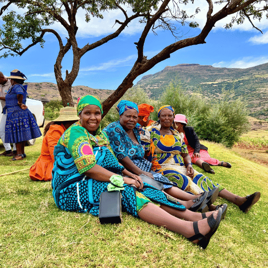 grannies sitting on the grass after a program session