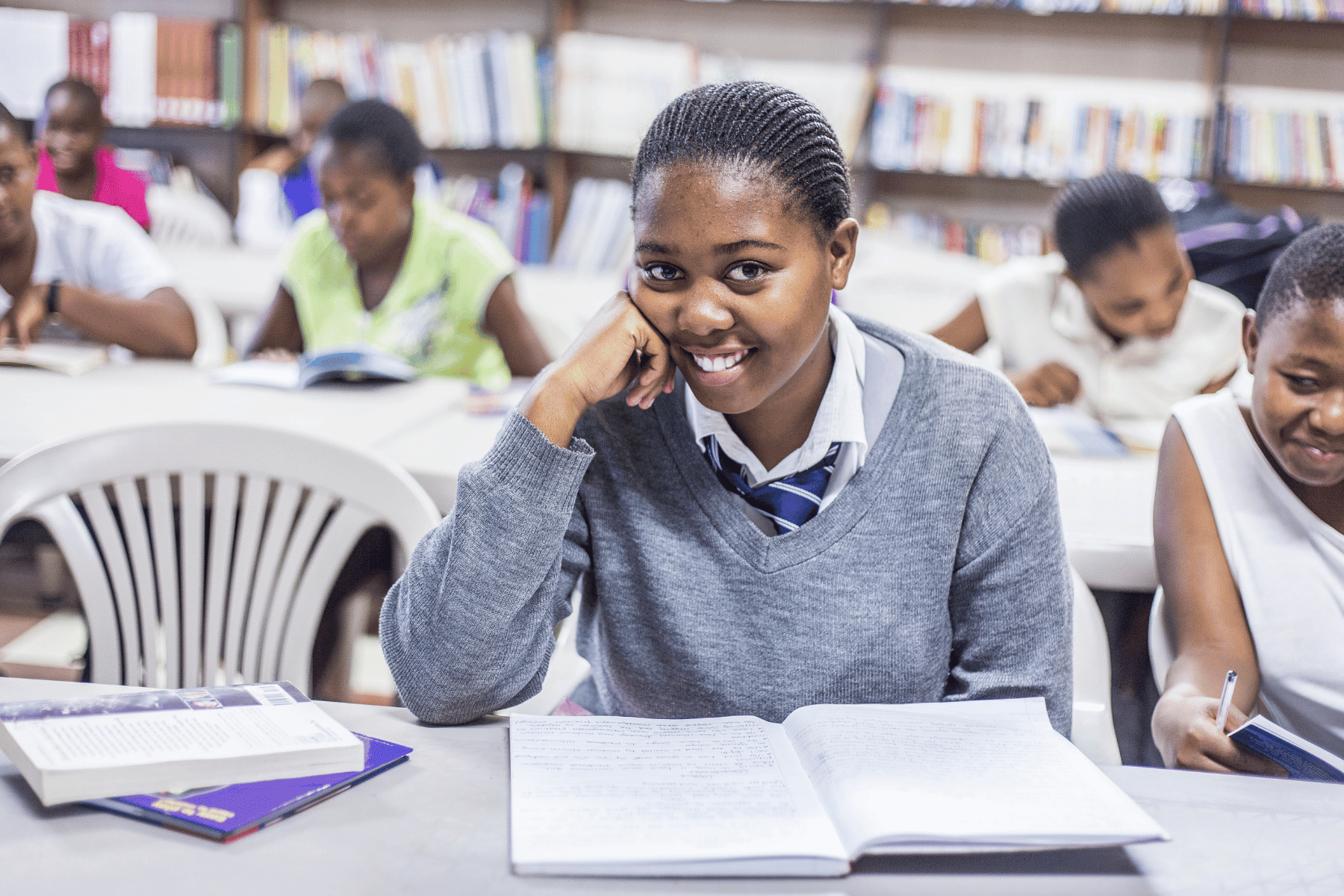 Untitled design (69) (1) girl at desk smiling