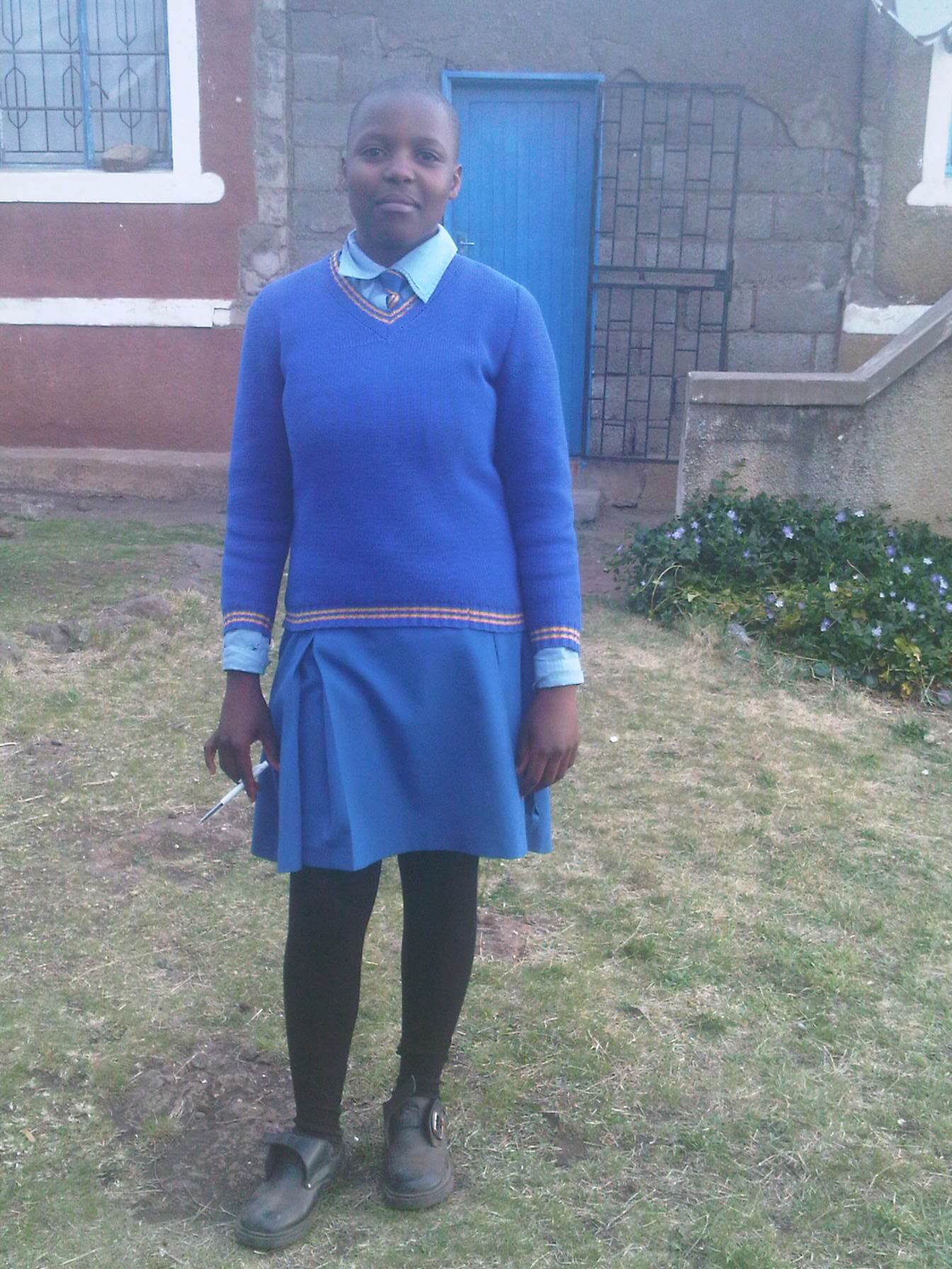 Lintle in front of her house