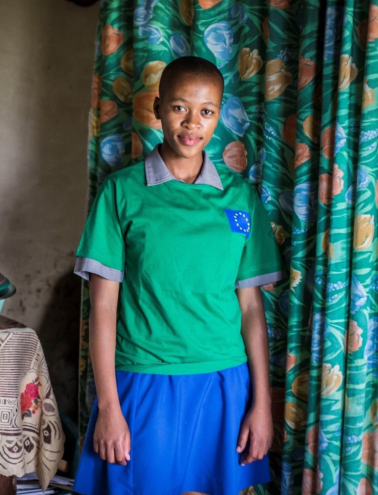 Lintle in front of her house