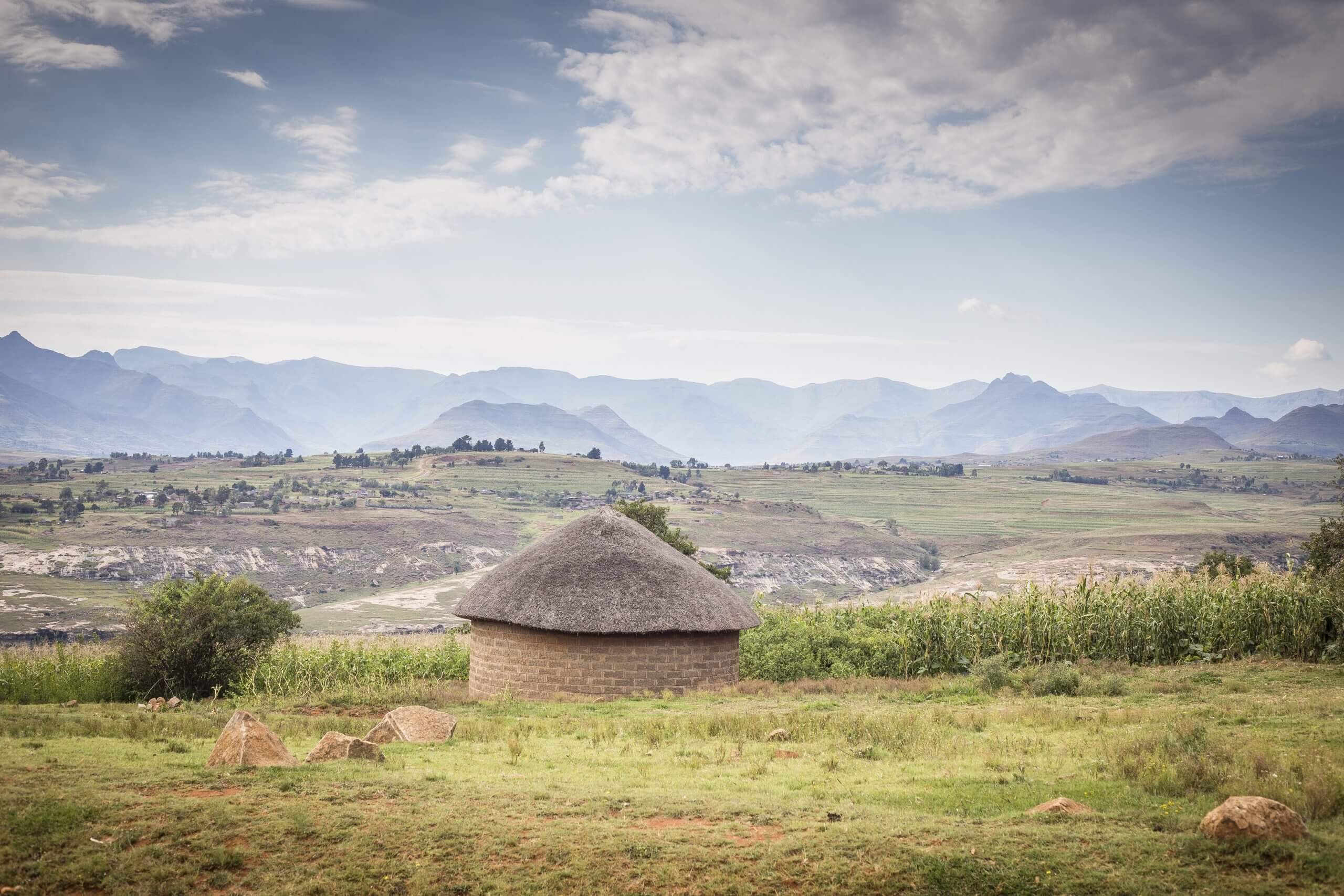 Lesotho rondavel with mountains in the background