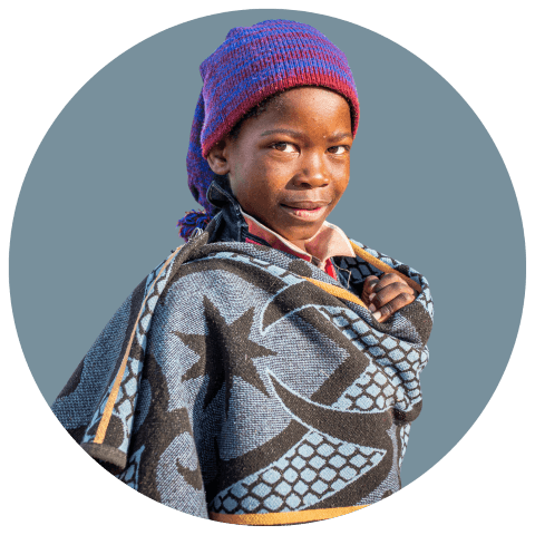 young Basotho mother carrying her baby on her back