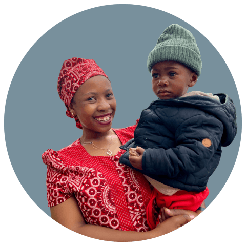 young Basotho mother carrying her baby on her back