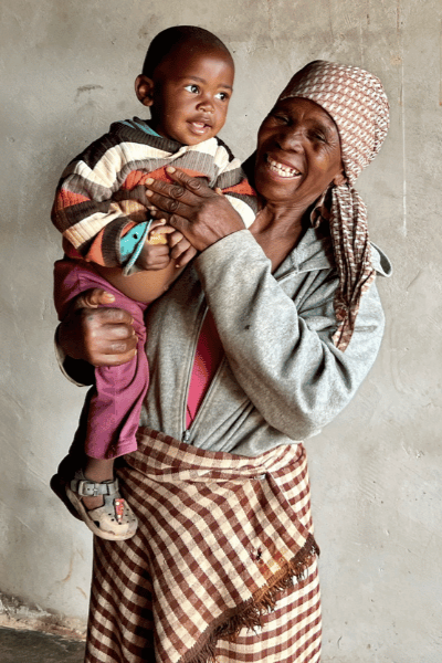 grandmother holding a child